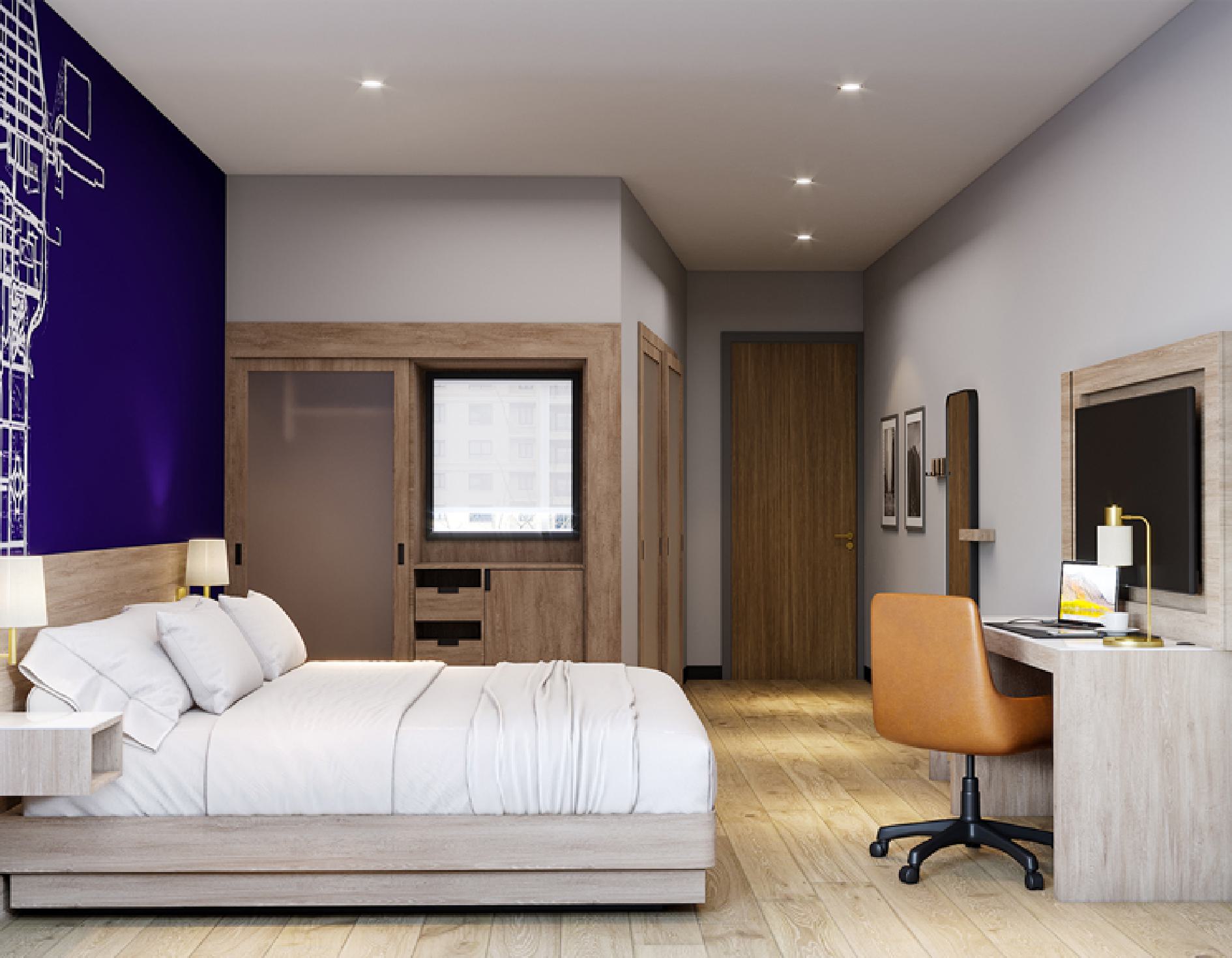 Guest room interior with city map accent wall, bed and desk area