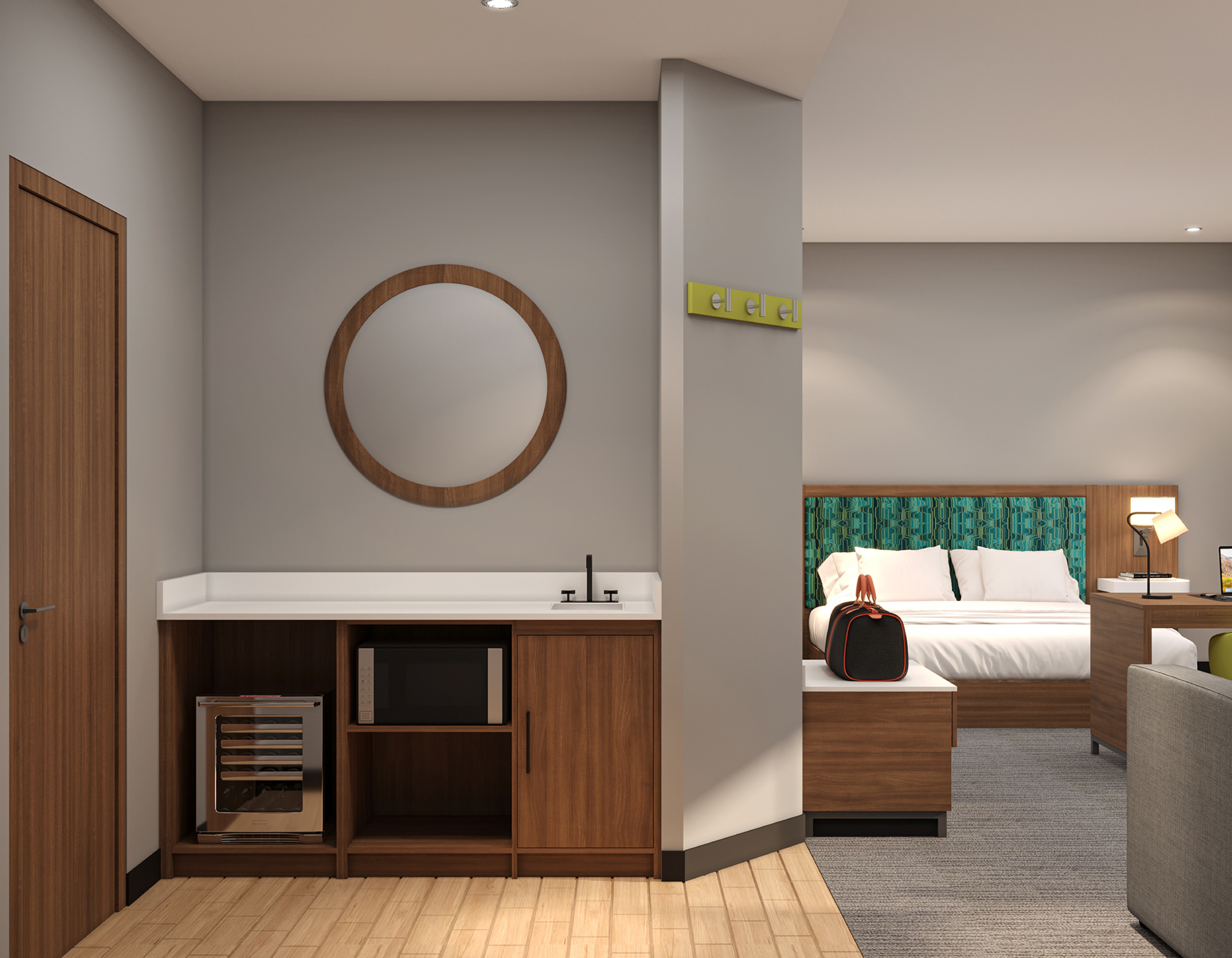 Guest room living area with sofa, desk and TV panel