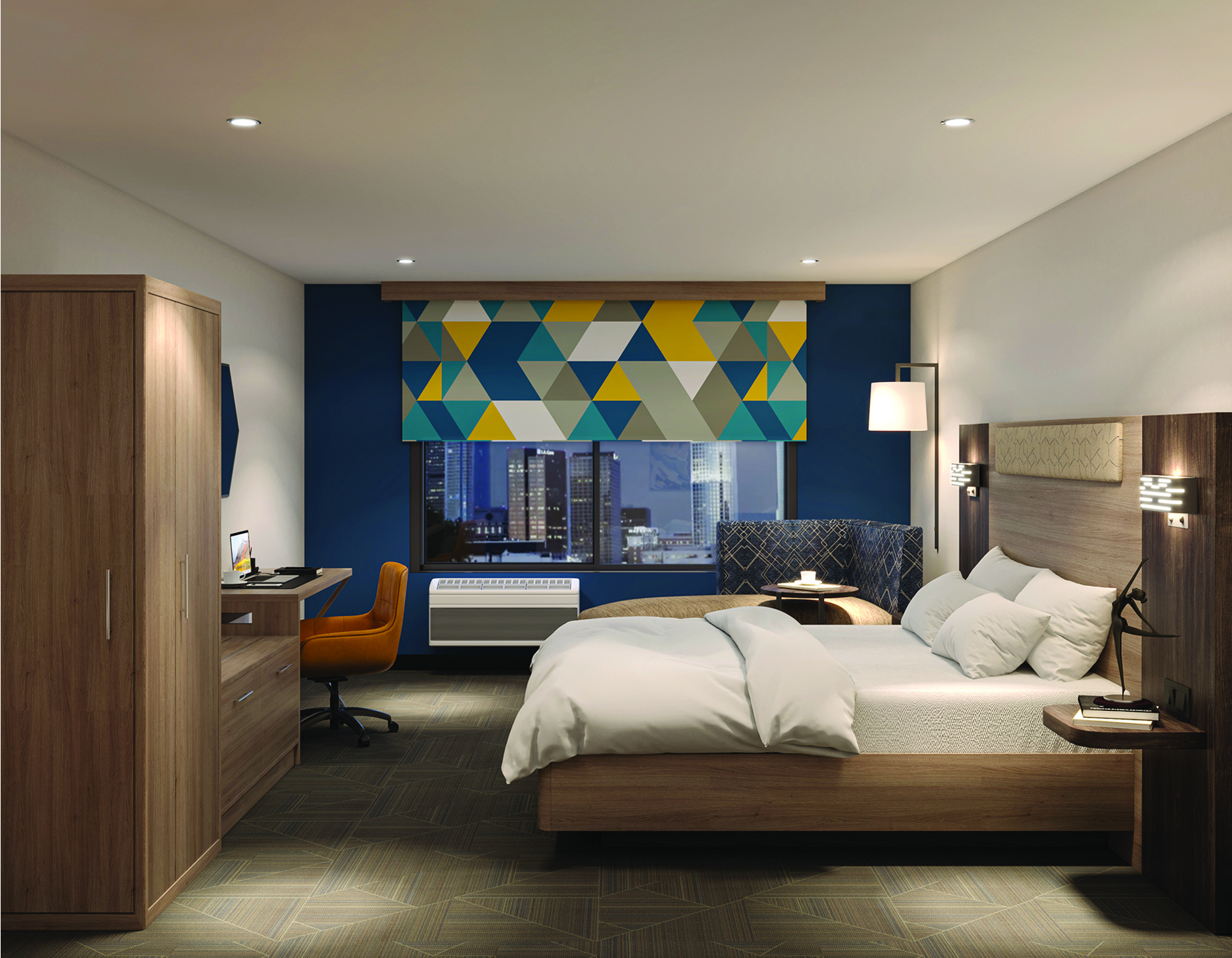 Hotel guest room with custom headboard, nightstands and bed