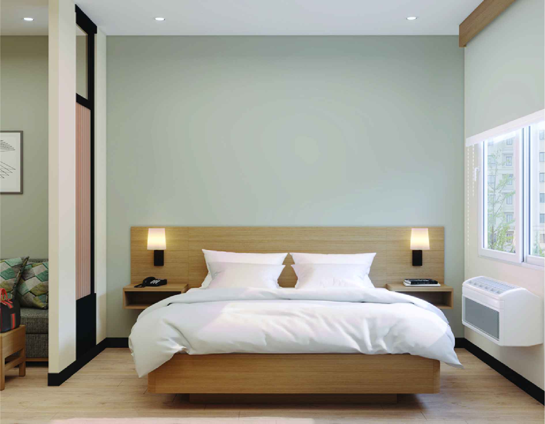 Hyatt Place guest room king bed with wood headboard and wall sconces