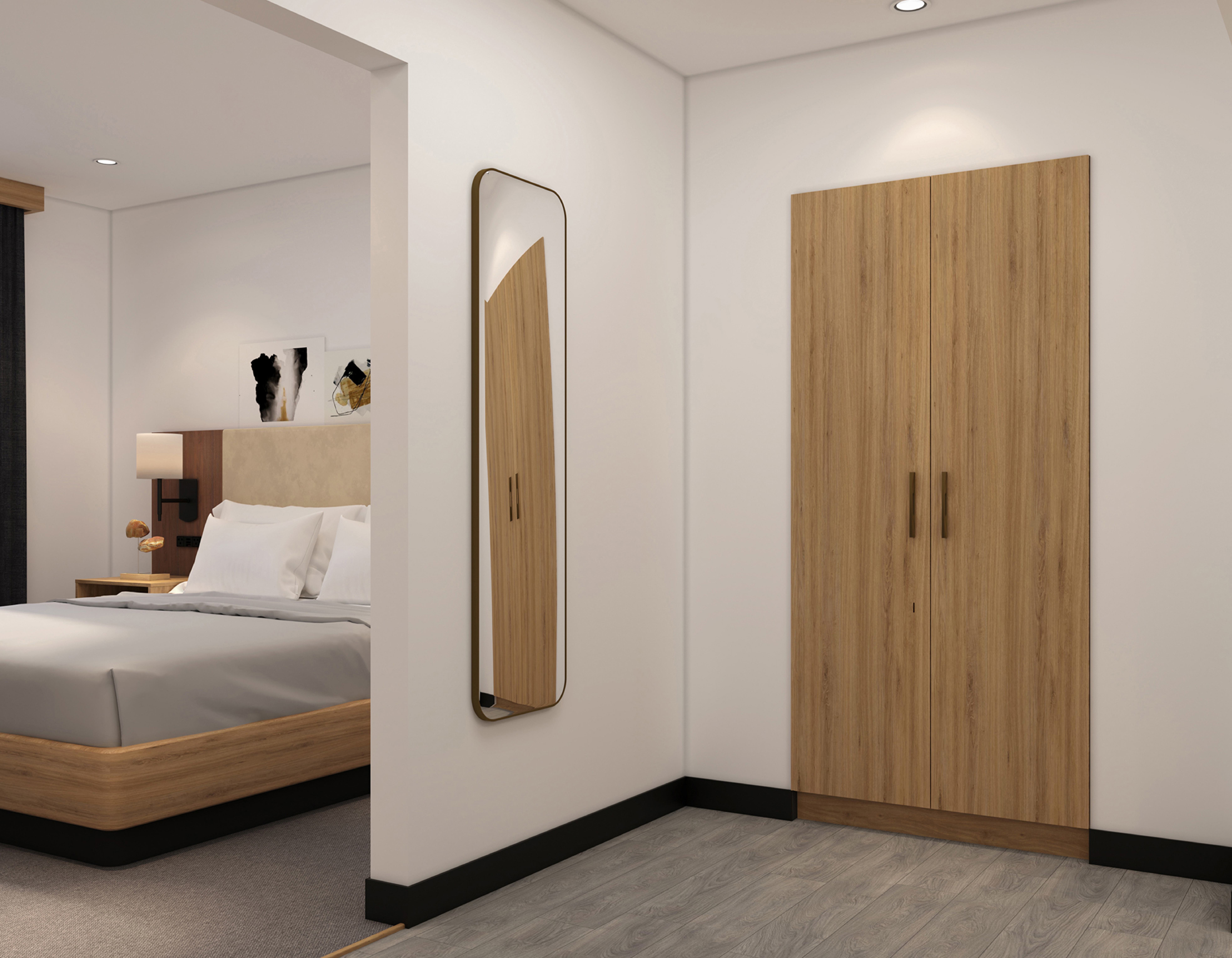 Guest room hallway with full-length mirror and wardrobe